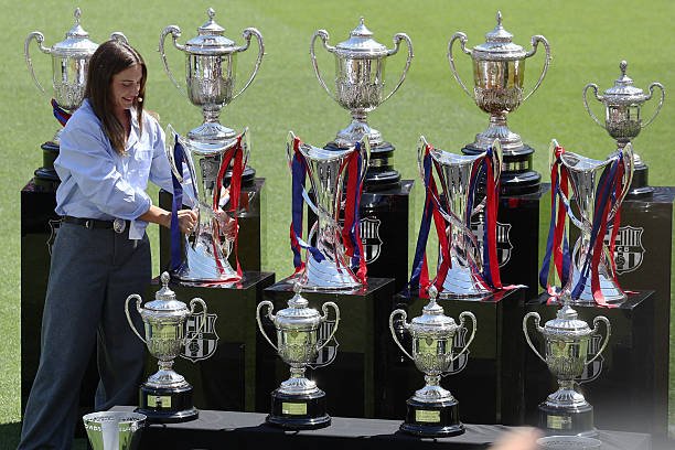 Barcelona captain Alexia Putellas takes her lastest Women's Champions League trophy during her farewell tribute ceremony at the Camp Nou stadium in...