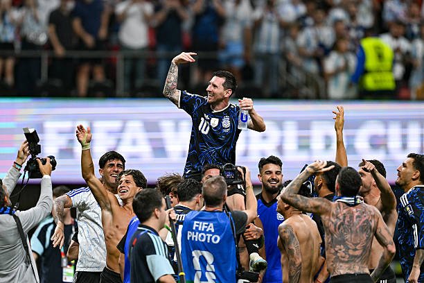 Argentina players lift Lionel Messi on their shoulders following the conclusion of the FIFA World Cup 2026 Semi-Final match between England and...