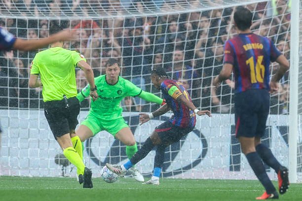 Barcelona's Brazilian forward Raphinha scores his team's first goal during the UEFA Champions League first round day 1 football match between FC...