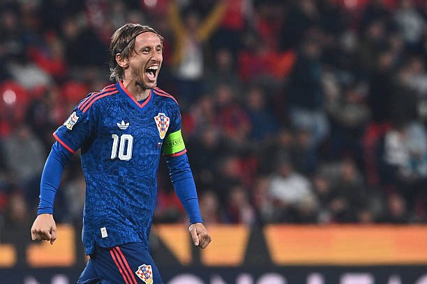 Croatia's midfielder Luka Modric celebrates scoring his team's first goal with team mates during the UEFA Nations League Group A3 football match...